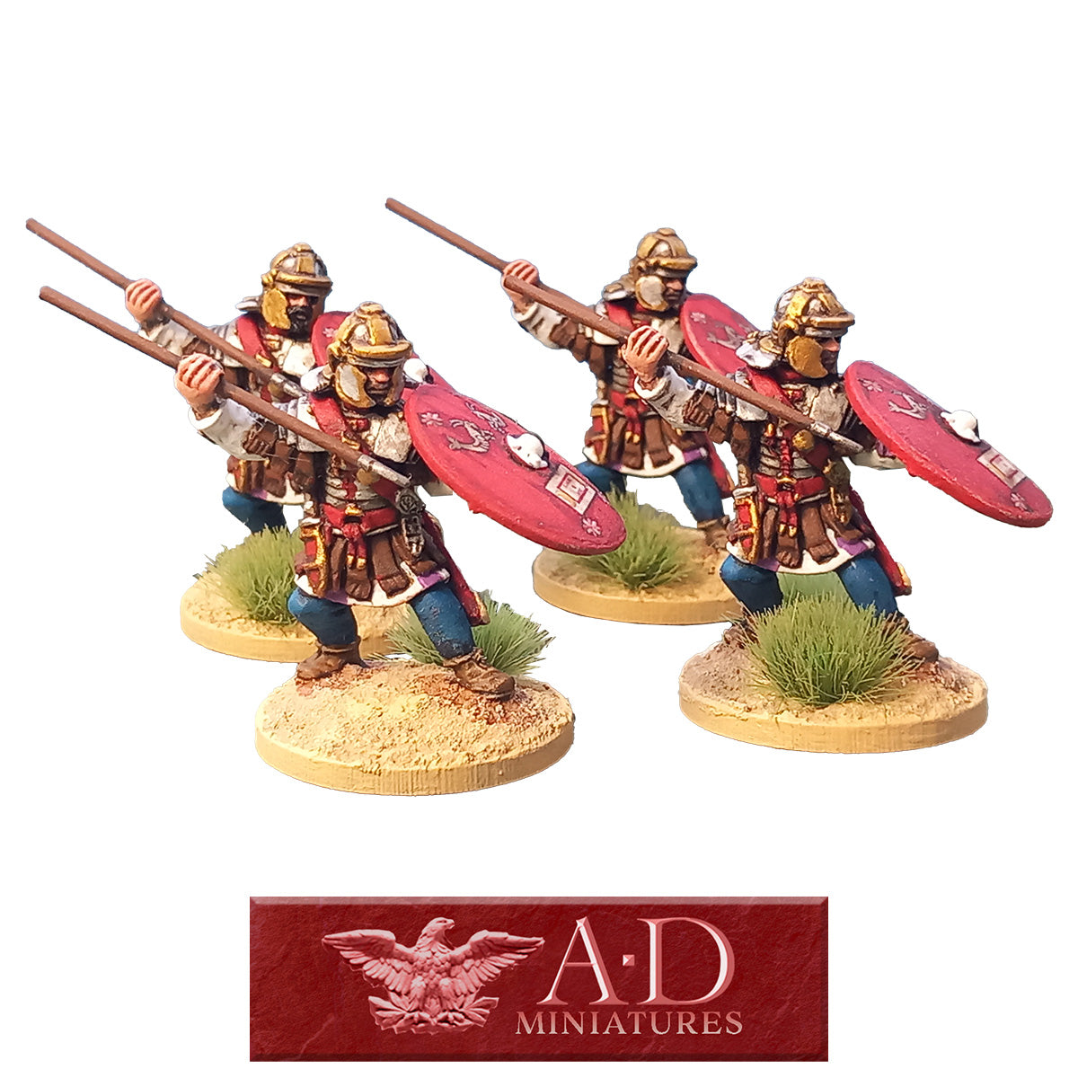 Four miniature figures of Roman warriors with Pila and shields. Featuring A.D. Miniatures logo.
