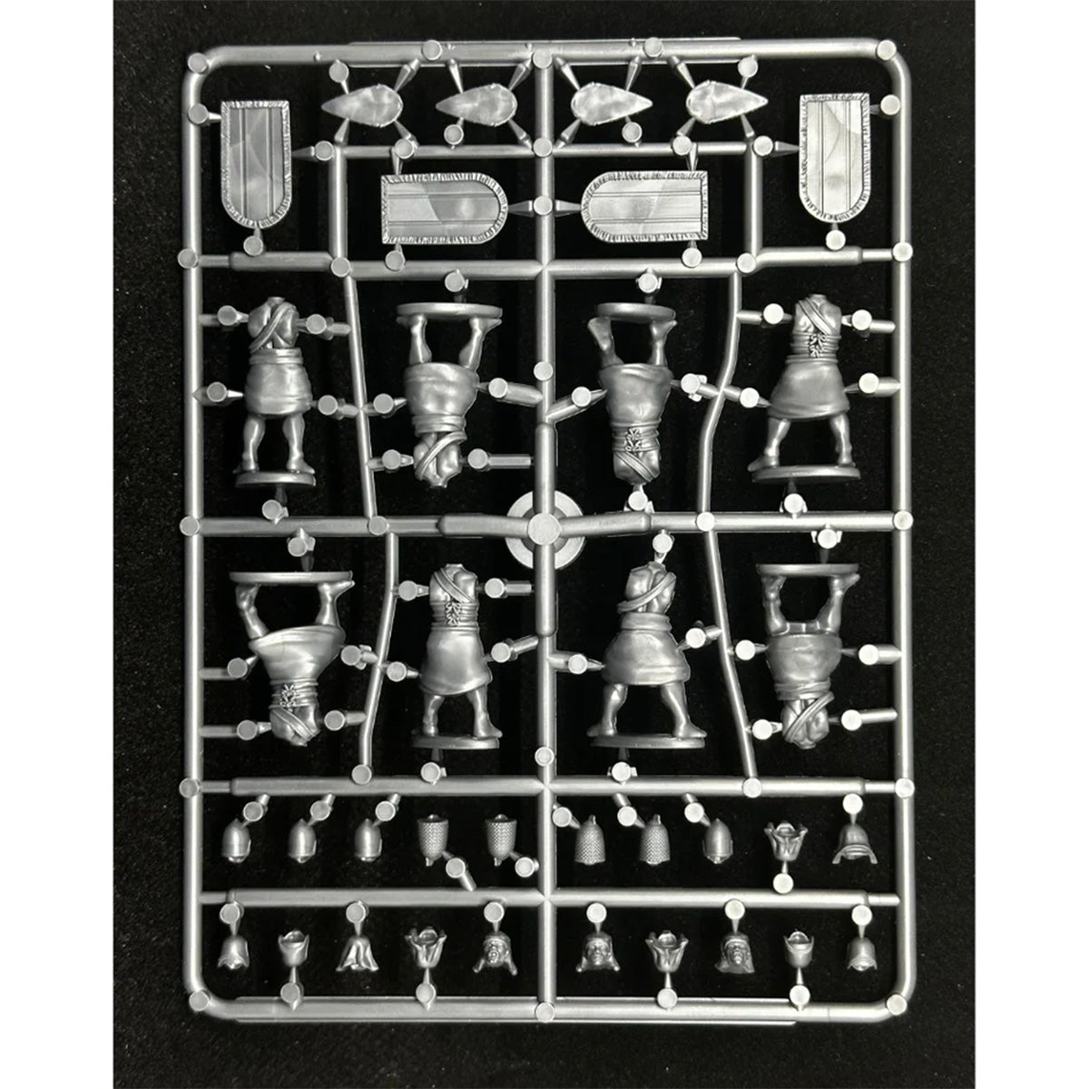 A grey, unpainted miniature figurine sprue (rear) of Egyptian Archers and Spearmen, by Wargames Atlantic.  